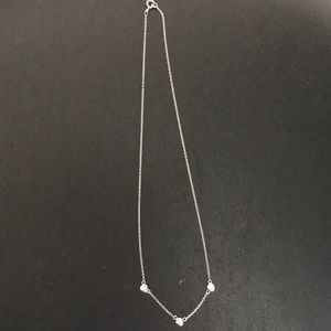 Silver rhodium triple bezel necklace.